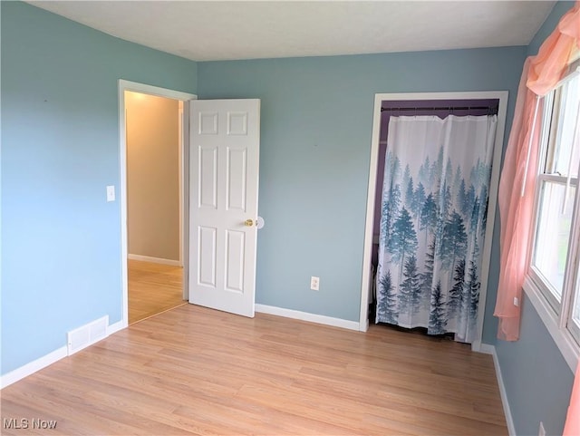 14864 Hayes Rd, Middlefield, OH 44062 - unfurnished bedroom featuring light wood finished floors and baseboards