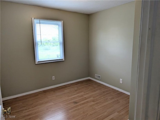 14864 Hayes Rd, Middlefield, OH 44062 - unfurnished room with light wood-type flooring and baseboards