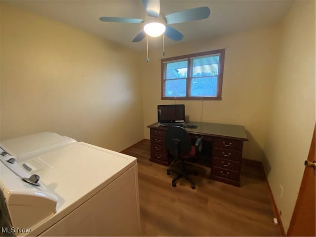 office featuring ceiling fan, washer and dryer, wood finished floors, and baseboards