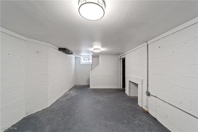 below grade area featuring concrete block wall