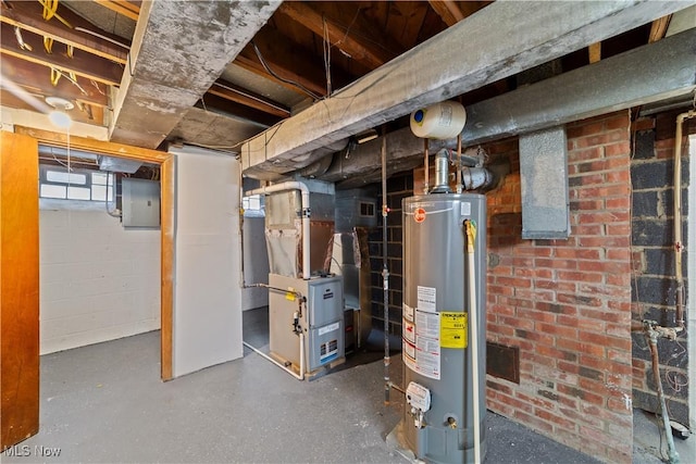 below grade area with electric panel, heating unit, and gas water heater