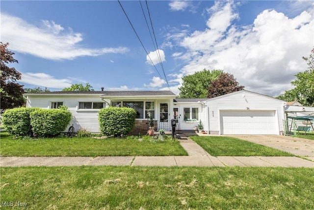 view of front of property with a garage, concrete driveway, and a front yard