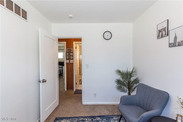 living area with carpet
