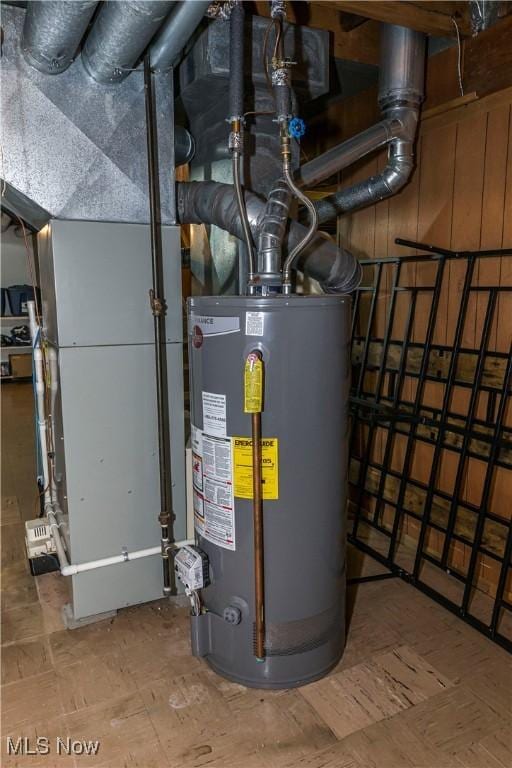 utility room featuring water heater