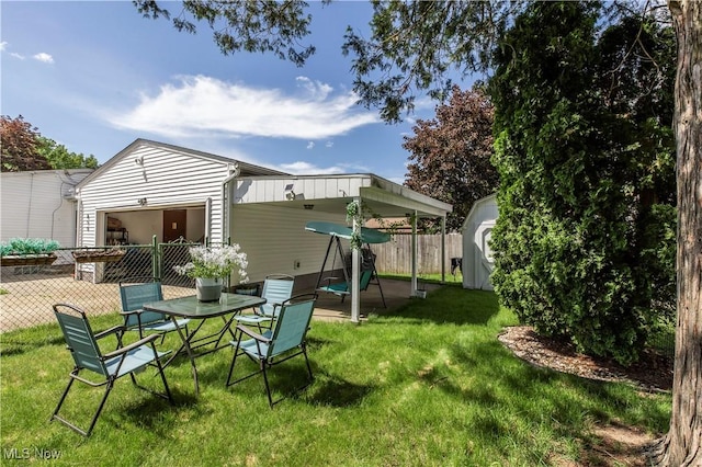 view of yard with a storage unit, an outdoor structure, and a patio area