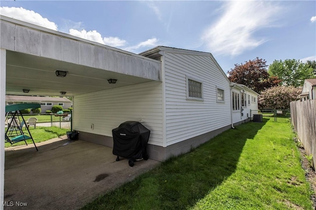 view of property exterior featuring central AC unit and a patio area