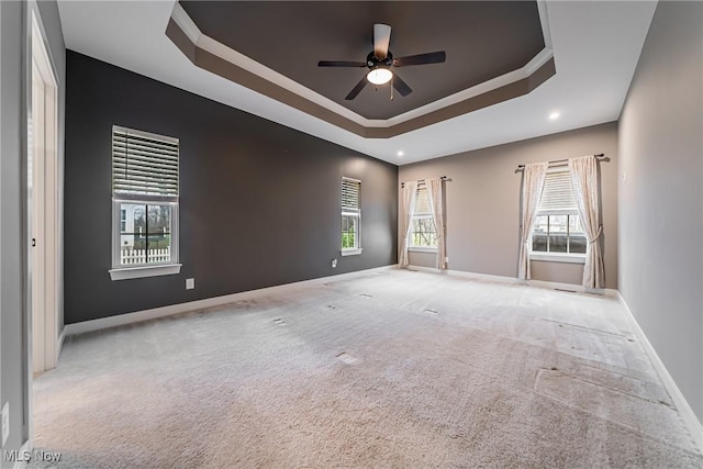 4643 Pebble Creek Ct, Peninsula, OH 44264 - carpeted empty room featuring baseboards, ceiling fan, a tray ceiling, and recessed lighting