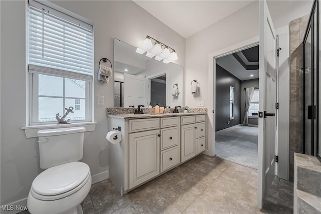 4643 Pebble Creek Ct, Peninsula, OH 44264 - bathroom with double vanity, baseboards, toilet, and a shower with door