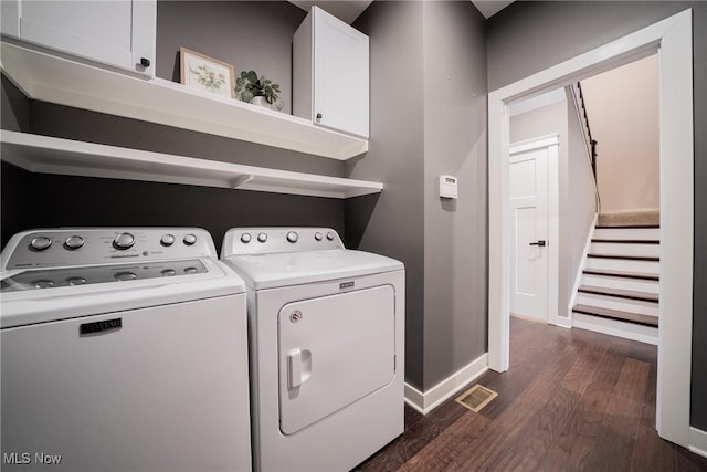 4643 Pebble Creek Ct, Peninsula, OH 44264 - washroom featuring cabinet space, dark wood-style floors, washer and clothes dryer, and baseboards