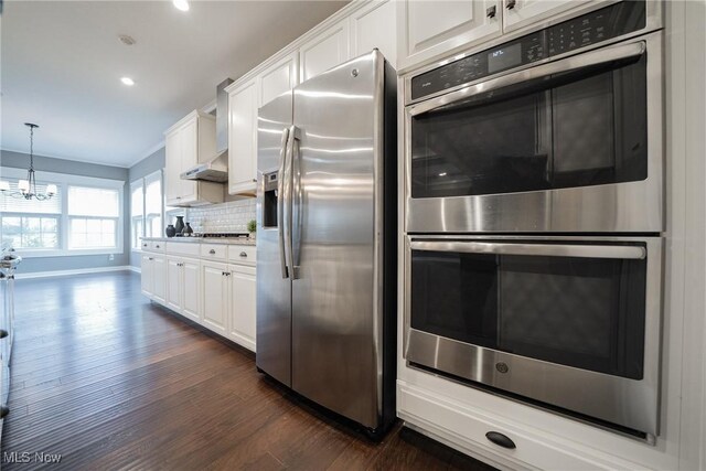 4643 Pebble Creek Ct, Peninsula, OH 44264 - kitchen featuring appliances with stainless steel finishes, dark wood-style flooring, a chandelier, white cabinets, and recessed lighting