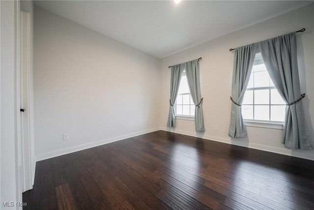 4643 Pebble Creek Ct, Peninsula, OH 44264 - unfurnished room featuring wood finished floors, baseboards, and vaulted ceiling