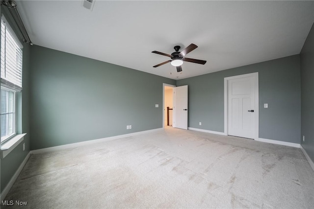 4643 Pebble Creek Ct, Peninsula, OH 44264 - unfurnished bedroom featuring multiple windows, carpet flooring, and baseboards