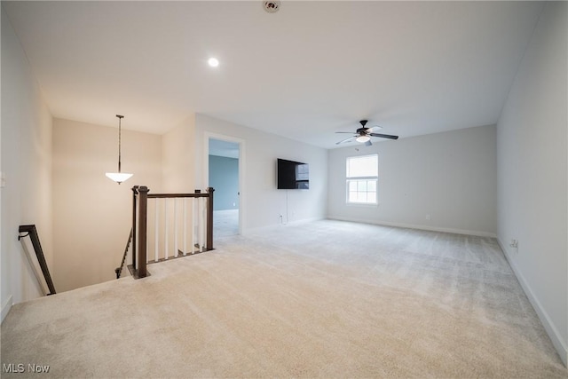 4643 Pebble Creek Ct, Peninsula, OH 44264 - unfurnished room with light carpet, ceiling fan, and baseboards