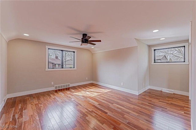 20601 Shelburne Rd, Shaker Heights, OH 44122 - unfurnished room with healthy amount of natural light, ceiling fan, lofted ceiling, light wood-type flooring, and recessed lighting