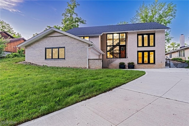20601 Shelburne Rd, Shaker Heights, OH 44122 - view of front of house featuring brick siding and a front lawn
