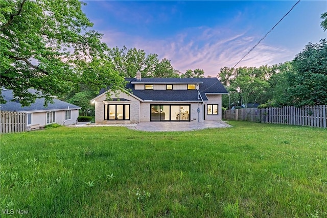 20601 Shelburne Rd, Shaker Heights, OH 44122 - rear view of house with a patio and a chimney