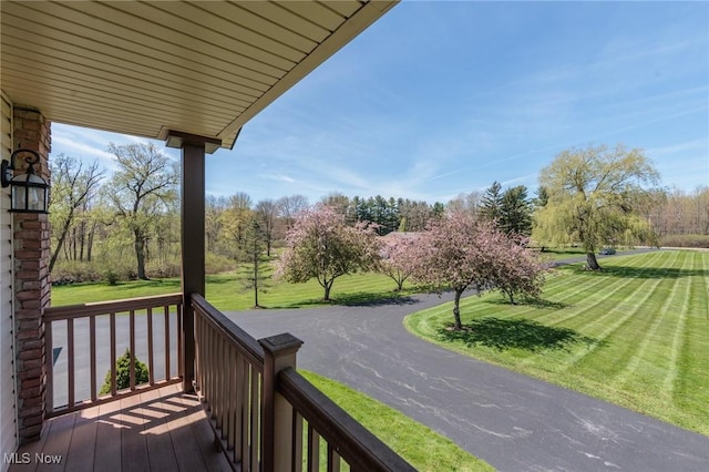 exterior space with a lawn and covered porch
