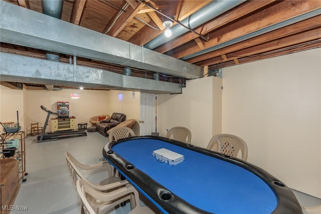 recreation room featuring finished concrete floors