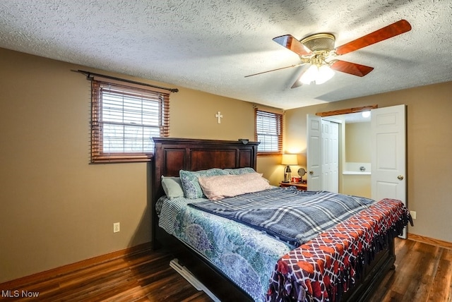 bedroom featuring baseboards, ceiling fan, wood finished floors, and a textured ceiling