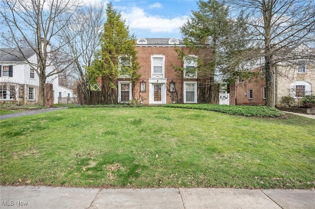 2691 Rocklyn Rd, Shaker Heights, OH 44122 - italianate house featuring brick siding and a front lawn