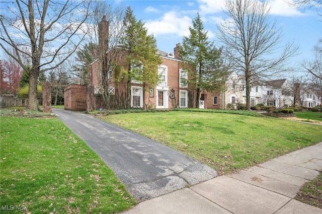 2691 Rocklyn Rd, Shaker Heights, OH 44122 - view of front facade with a front yard and a chimney