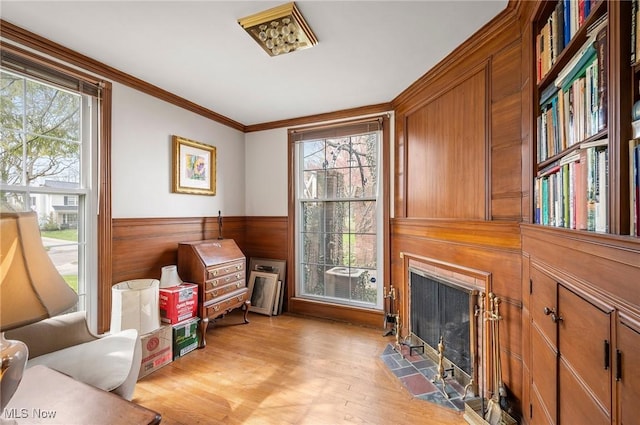2691 Rocklyn Rd, Shaker Heights, OH 44122 - sitting room with ornamental molding, a wealth of natural light, light wood-type flooring, and a fireplace with flush hearth