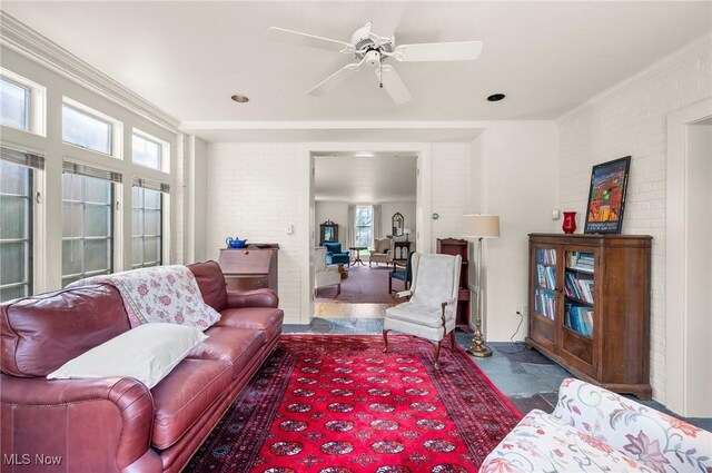 2691 Rocklyn Rd, Shaker Heights, OH 44122 - living room featuring brick wall, crown molding, and a ceiling fan