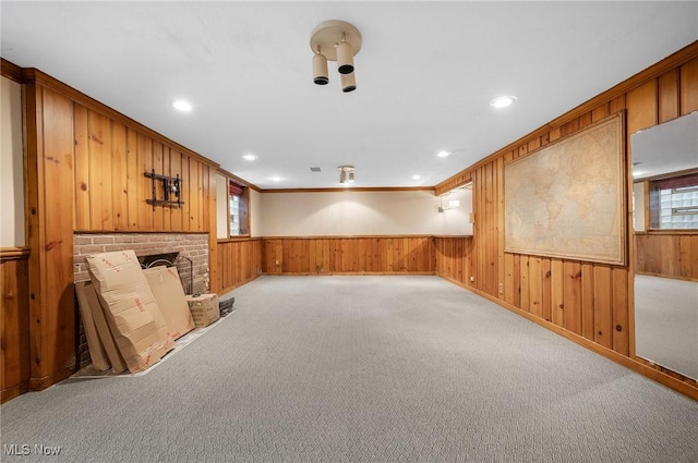 2691 Rocklyn Rd, Shaker Heights, OH 44122 - basement featuring wood walls, a fireplace, carpet flooring, and wainscoting