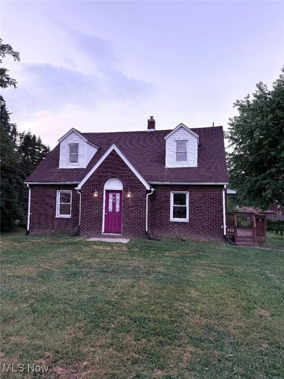 270 Coitsville Rd, Campbell, OH 44405 - view of front of property with brick siding, a chimney, a front lawn, and a wooden deck