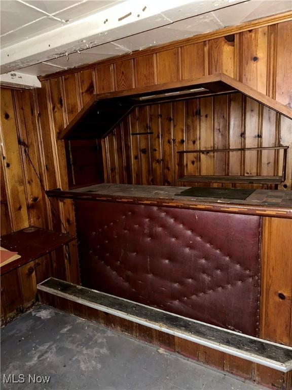 471 W Hylda, Youngstown, OH 44511 - bar featuring wood walls and unfinished concrete flooring