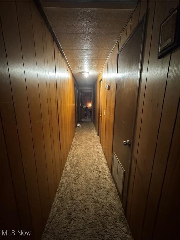1110 3rd St, Belpre, OH 45714 - hall with carpet floors and wooden walls
