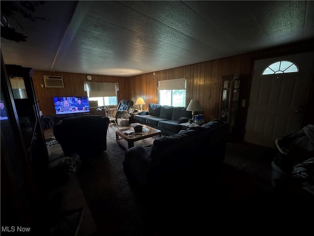 1110 3rd St, Belpre, OH 45714 - carpeted living room featuring wooden walls and a wall unit AC