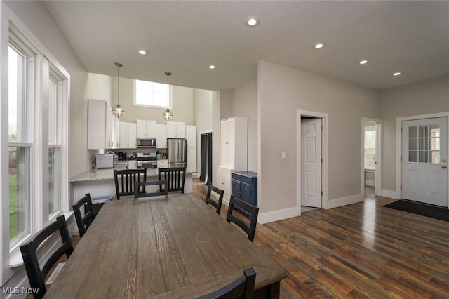 1733 State Route 303, Streetsboro, OH 44241 - dining room featuring dark wood-type flooring, baseboards, a high ceiling, and recessed lighting