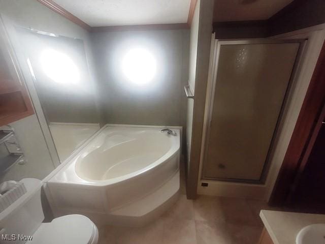 bathroom with vanity, a stall shower, tile patterned flooring, toilet, and a garden tub