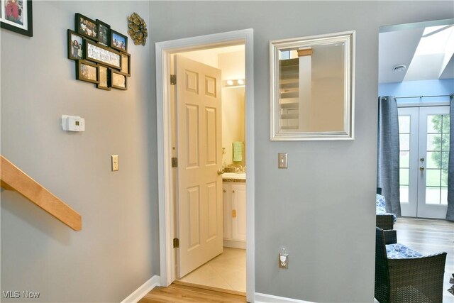 345 S Linden Ct, Warren, OH 44484 - interior space featuring baseboards, light wood-style floors, and a skylight
