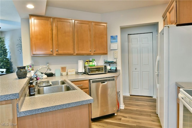 345 S Linden Ct, Warren, OH 44484 - kitchen with light wood-type flooring, recessed lighting, a toaster, white appliances, and a sink