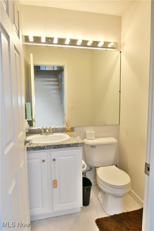 345 S Linden Ct, Warren, OH 44484 - half bathroom featuring tile patterned flooring, vanity, and toilet