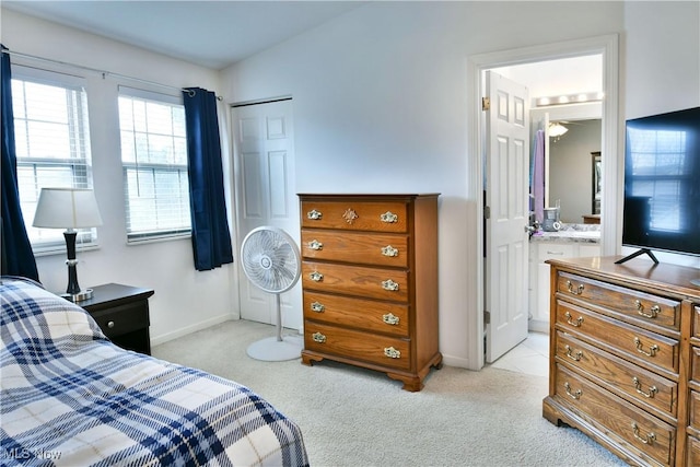 345 S Linden Ct, Warren, OH 44484 - bedroom with light carpet, ensuite bath, and baseboards