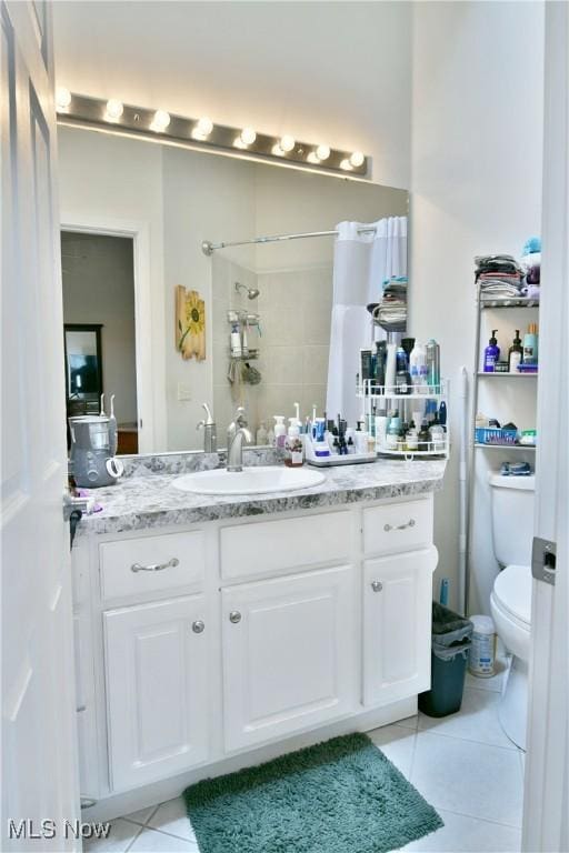 345 S Linden Ct, Warren, OH 44484 - bathroom featuring toilet, tile patterned floors, vanity, and a shower with curtain