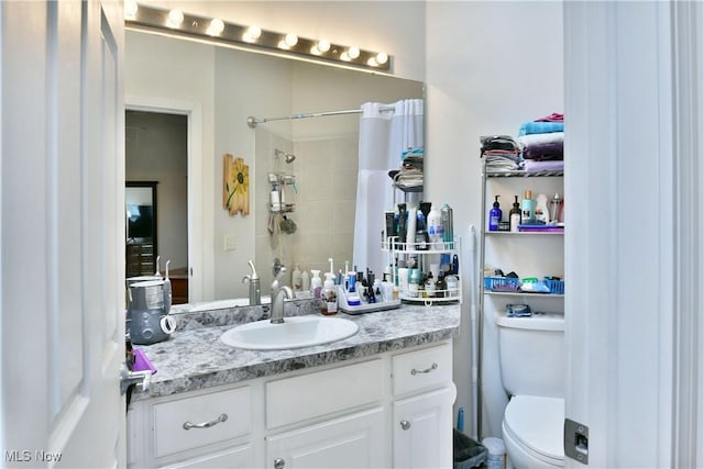 345 S Linden Ct, Warren, OH 44484 - bathroom with a shower, vanity, and toilet