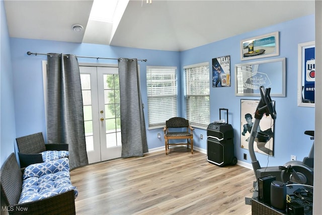 345 S Linden Ct, Warren, OH 44484 - interior space with visible vents, french doors, lofted ceiling with skylight, and wood finished floors