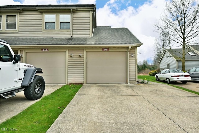 345 S Linden Ct, Warren, OH 44484 - exterior space featuring an attached garage and concrete driveway