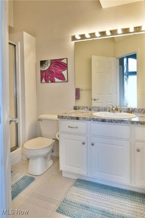 345 S Linden Ct, Warren, OH 44484 - bathroom with toilet, tile patterned flooring, vanity, and a stall shower