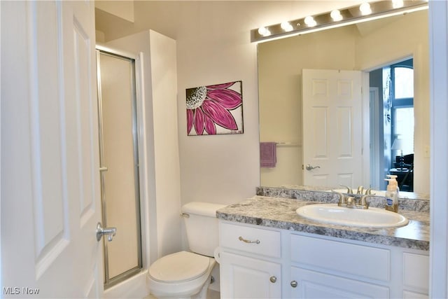 345 S Linden Ct, Warren, OH 44484 - bathroom with toilet, a stall shower, and vanity
