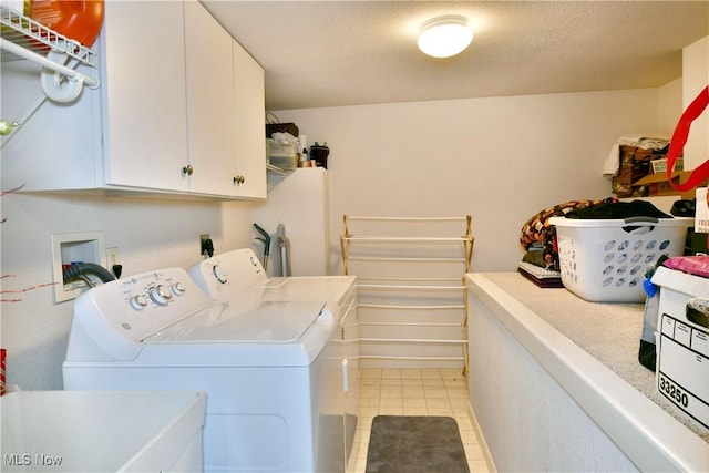 345 S Linden Ct, Warren, OH 44484 - clothes washing area with cabinet space, light tile patterned floors, and washer and clothes dryer