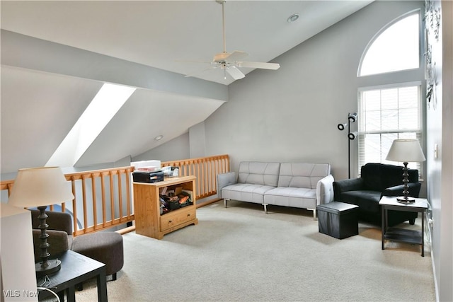 345 S Linden Ct, Warren, OH 44484 - carpeted living room featuring a skylight, high vaulted ceiling, radiator heating unit, and a ceiling fan
