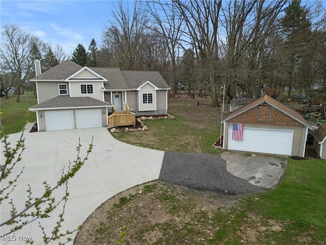 split level home with a front yard and roof with shingles