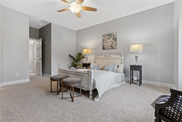 carpeted bedroom with visible vents, baseboards, and ceiling fan