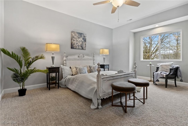 carpeted bedroom featuring baseboards and ceiling fan