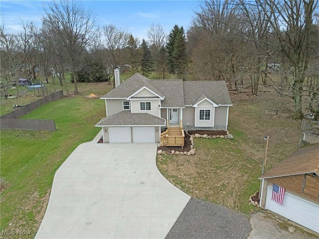 view of front facade with a garage, a chimney, concrete driveway, a front lawn, and roof with shingles